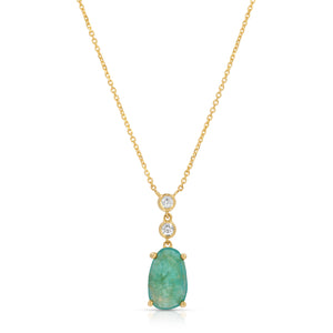 A 14k yellow gold drop pendant necklace on a white background, featuring a natural rose-cut grandidierite stone crowned by two stacked white diamonds on a fine gold chain. A 14k yellow gold drop pendant necklace on a white background, featuring a natural rose-cut grandidierite stone crowned by two stacked white diamonds on a fine gold chain.
